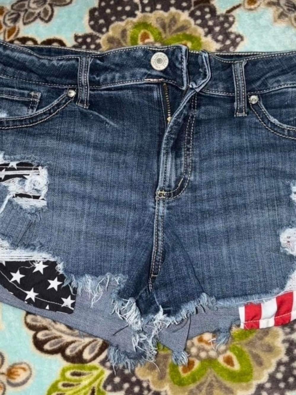 Distressed Denim SilverJEans CO Cutoff Shorts with Flag Patch